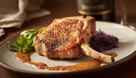 Oven-Roasted Pork Loin Chop and Cider Braised Cabbage with Whole Grain Mustard Pan-Sauce