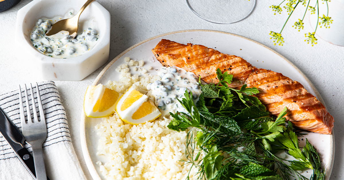 Grilled Salmon with Caper, Lemon and Dill sauce, Served with Cauliflower Rice and Herb Salad