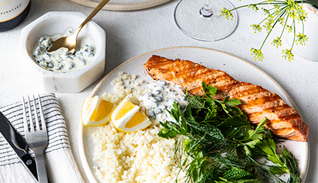 Grilled Salmon with Caper, Lemon and Dill sauce, Served with Cauliflower Rice and Herb Salad