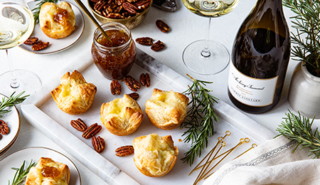 Mini Puff Pastry Brie Bites with Fig Jam and Candied Rosemary Pecans
