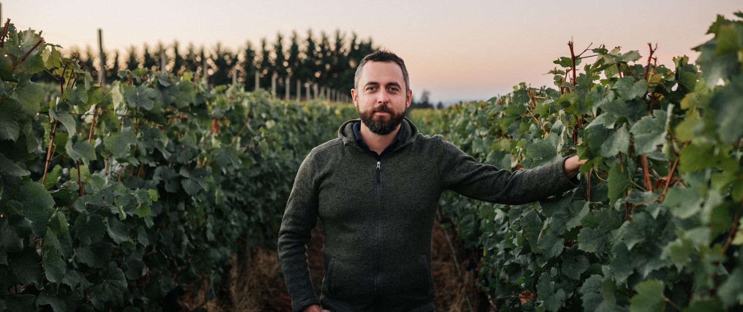 Our winemaker in front of the Archery Summit vineyards