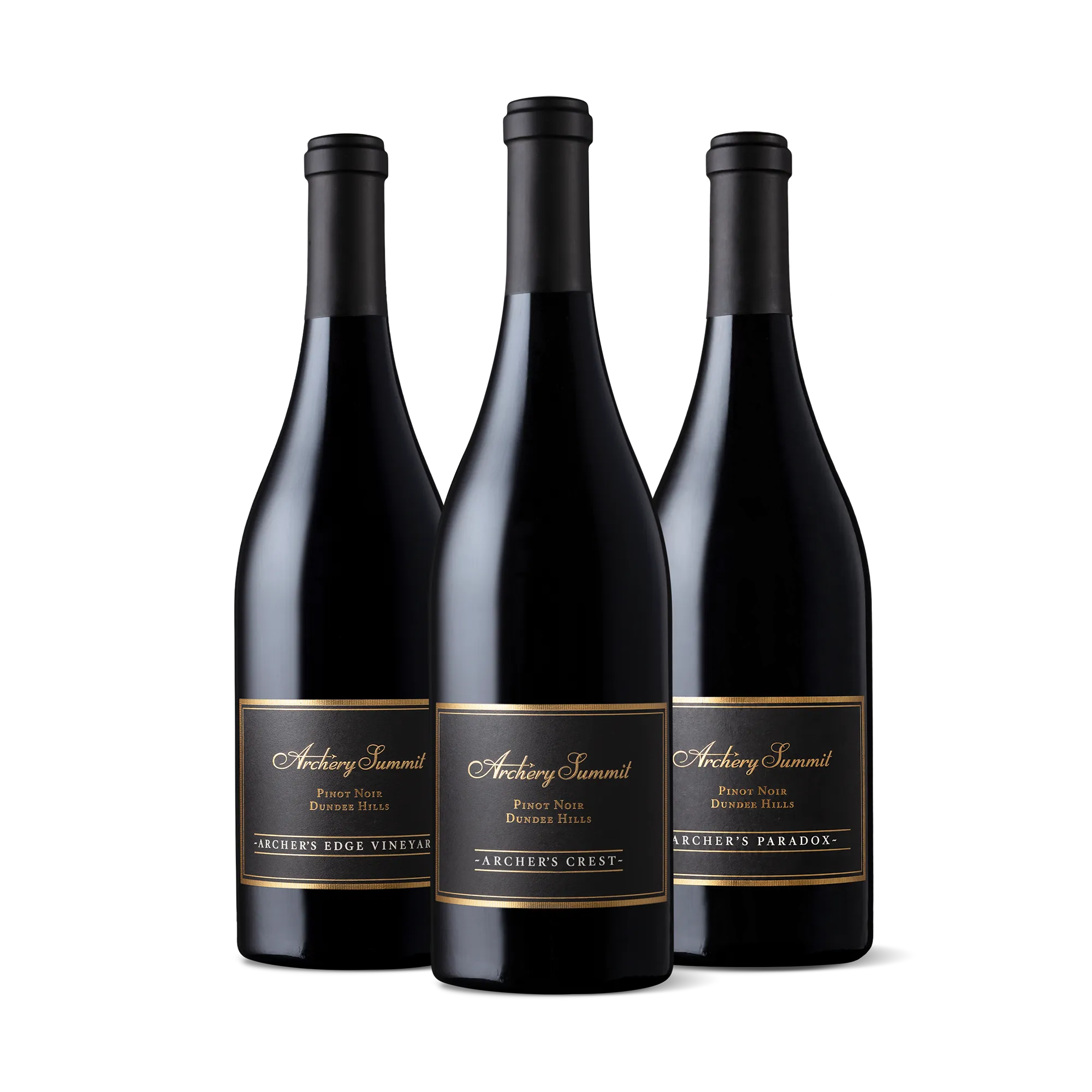 Three dark wine bottles labeled Archery Summit Pinot Noir stand side by side on a white background. Each bottle has a different vineyard name: Archers Edge Vineyard, Archers Crest, and Archers Paradox. Discover the Edge of Elegance: The Archer’s Pinot 3-Bottle Collection—an exquisite selection showcasing the distinct character of each vineyard.